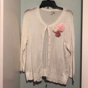 White cardigan with rosettes